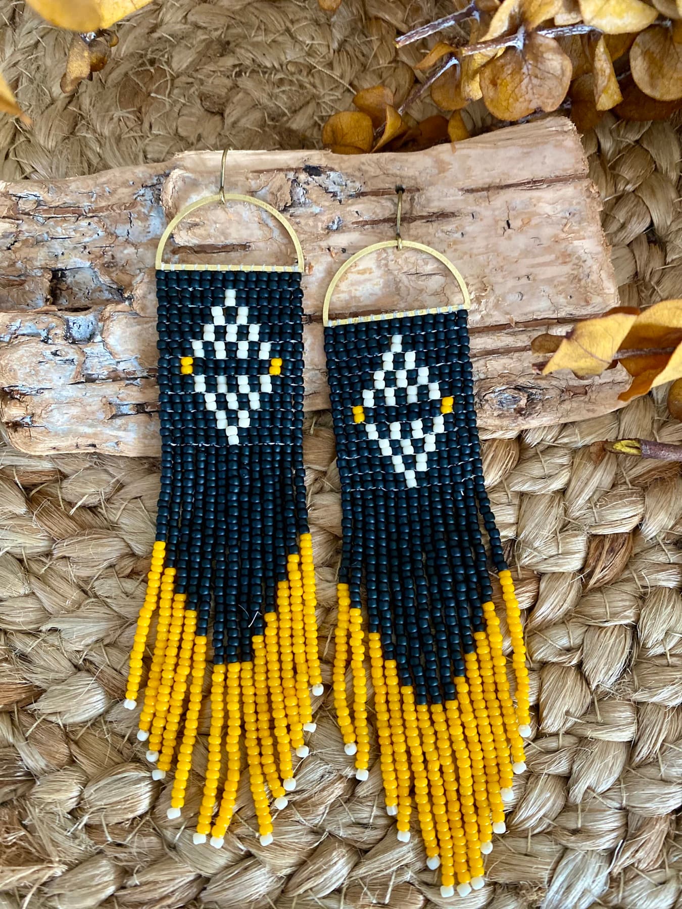 Pair of black and yellow hand-beaded fringe earrings