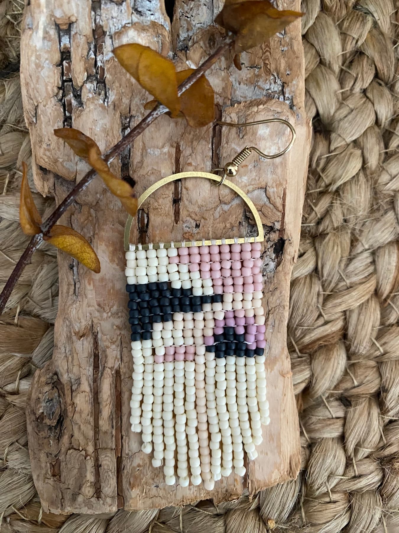 Cream, pink, and black hand-beaded fringe earring